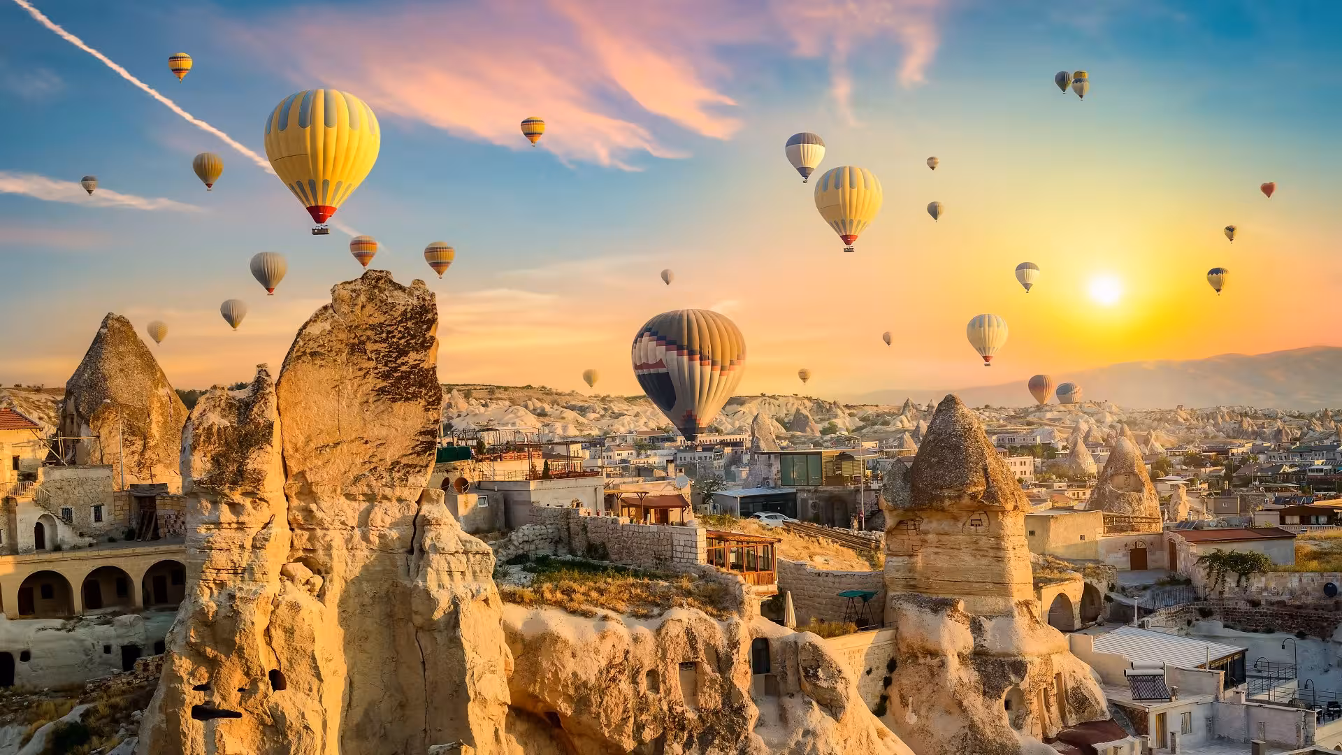 Cappadocia sunrise hot air balloons over fairy chimneys on 8-day Turkey tour Istanbul to Ankara route