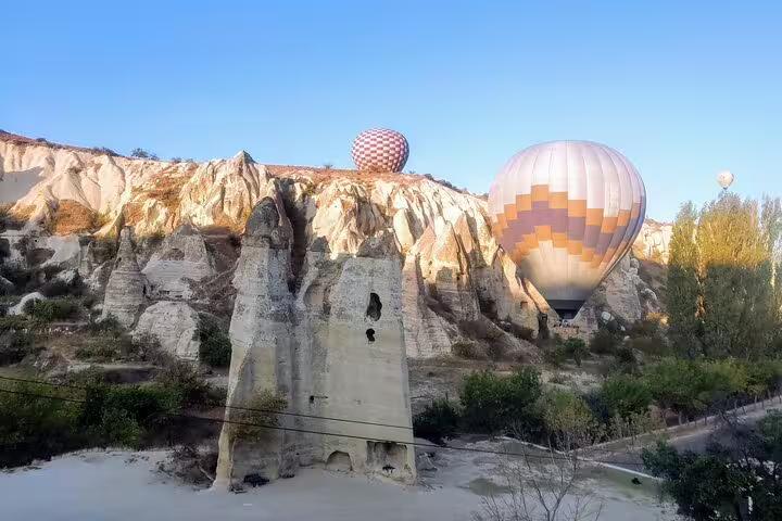 Cappadocia hot air balloons drifting above fairy chimneys on 8-day Turkey mini group flight tour