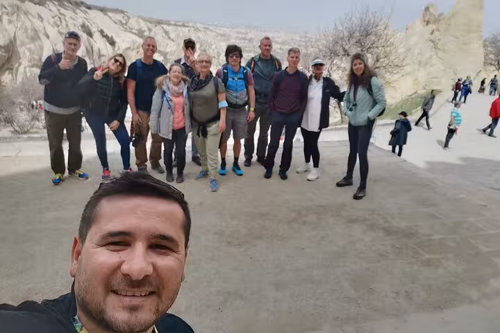 Private Cappadocia tour from Istanbul by plane group photo at fairy chimneys viewpoint in Goreme Valley