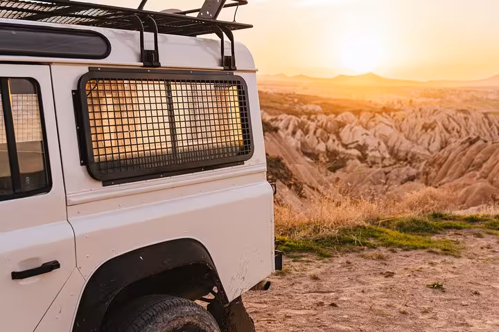 4x4 jeep at sunrise over Cappadocia valleys on 2-day 1-night Istanbul by plane tour with balloon ride