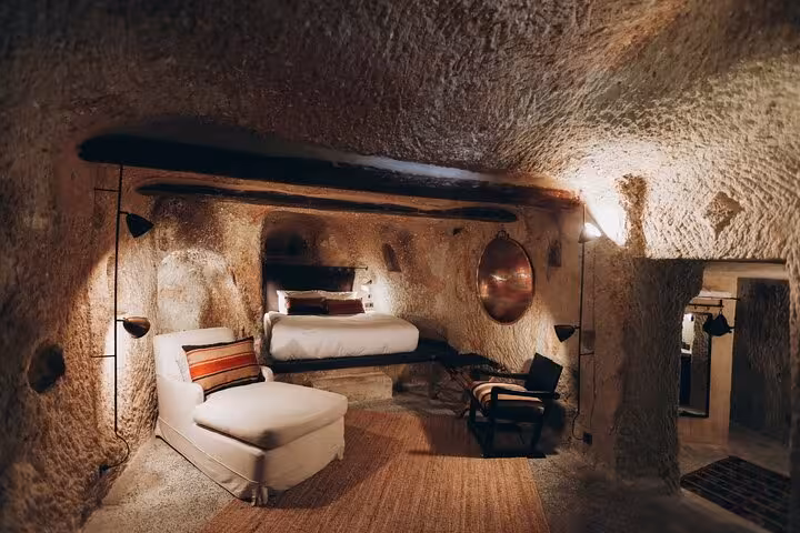Luxury Cappadocia cave hotel room stop on private tour from Istanbul by plane, authentic rock-cut interior