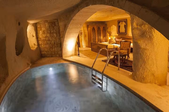 Luxury Cappadocia cave suite with indoor pool, premium accommodation on Business Class tour by plane