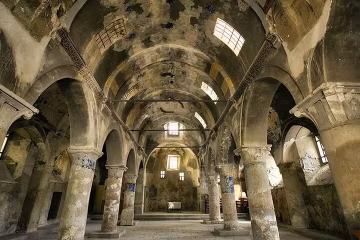 Arched stone hall of an ancient Cappadocia monastery on a full-day private underground heritage tour