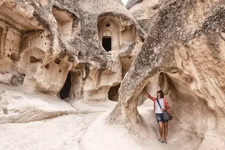 Traveler explores Cappadocia cave dwellings and rock-cut churches on the North Tour before Turkish hamam
