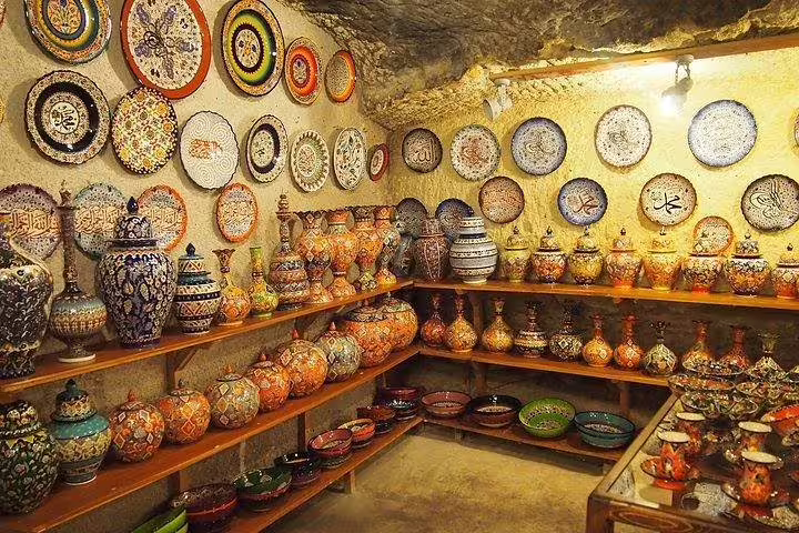 Explore the vibrant pottery and traditional crafts of Cappadocia in a charming local artisan's shop.