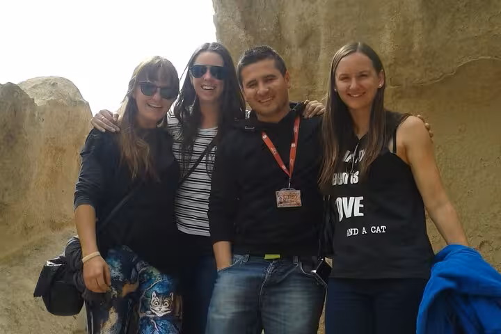 Happy travelers with local guide on Cappadocia private tour from Istanbul by plane among rock formations