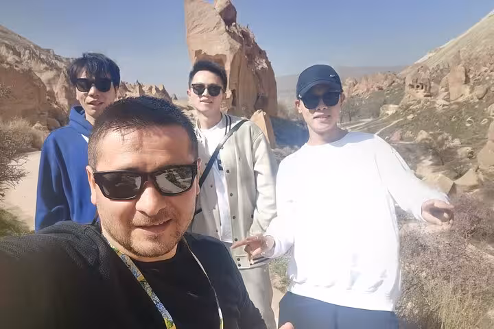 Guests on Cappadocia private tour from Istanbul by plane taking a selfie in scenic Love Valley