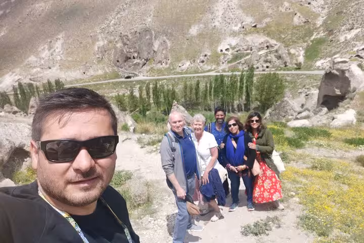 Small group photo at a scenic overlook in Cappadocia valley during an undiscovered full-day private tour