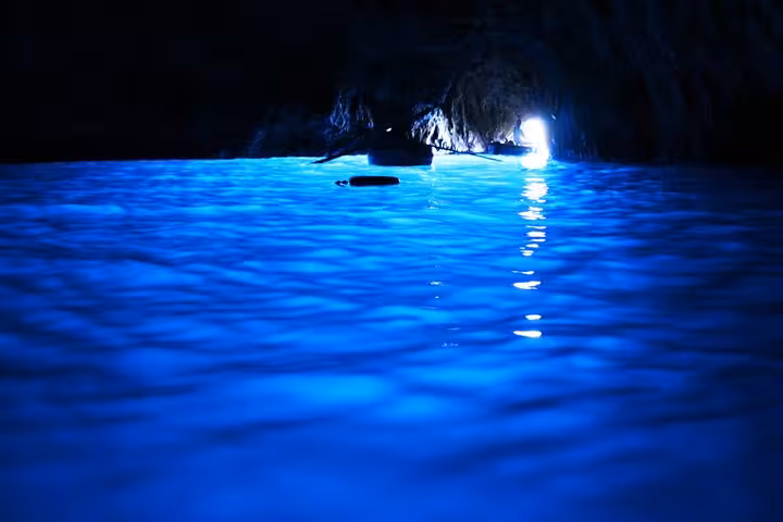 Experience the enchanting Blue Grotto's glowing waters on a Capri tour from Sorrento, a must-see natural wonder.