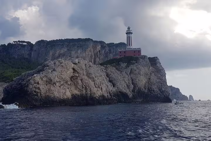 Private full-day boat tour past Punta Carena Lighthouse and dramatic Capri cliffs on a Sea Day cruise