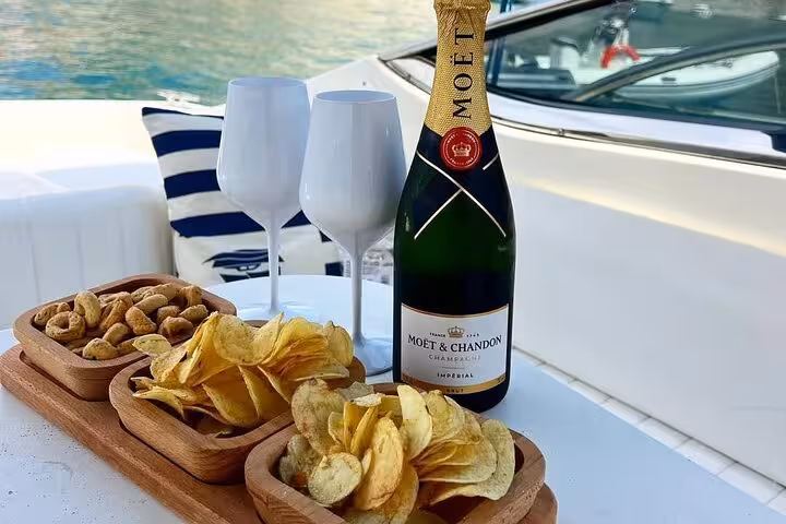 Luxury boat setup with Moët champagne, snacks, and goblets, ideal for a Capri Island boat tour from Naples.
