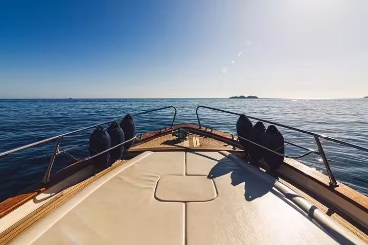 View from the deck of a Gozzo Apreamare 10 boat, overlooking the serene sea on a Capri and Positano tour from Sorrento.