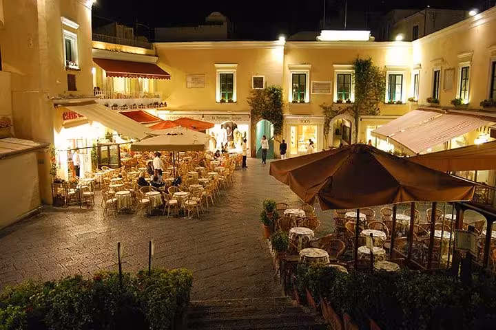 Charming evening ambiance at a Capri square café, part of the Capri Sunset Escape tour experience.