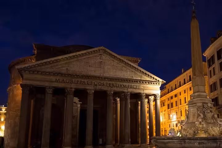 Illuminated Pantheon at night showcasing Rome's historic architecture and ancient allure.