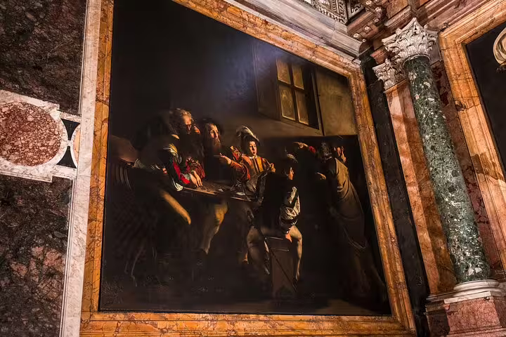 Caravaggio Baroque masterpiece painting illuminated inside a Rome church, featured on a private Caravaggio art history tour