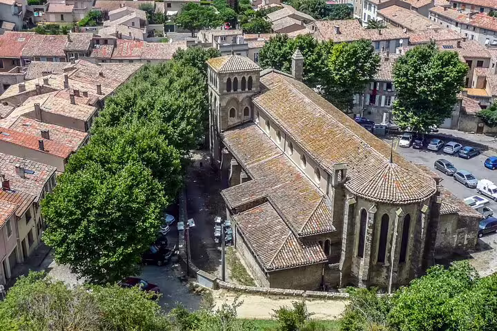 Aerial view of Carcassonne church and old town rooftops on a self-guided scavenger hunt highlights tour