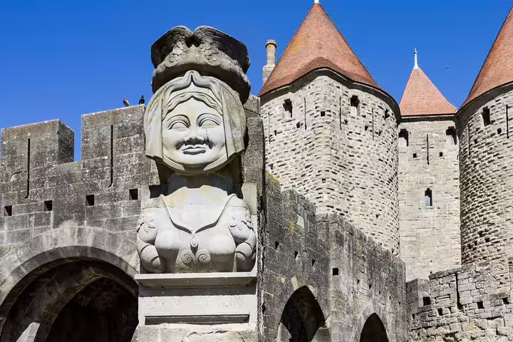 Carcassonne fortress gate sculpture with medieval towers, key stop on a self-guided scavenger hunt tour