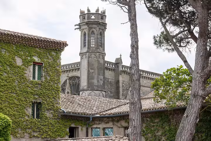 Historic ivy-clad building with Gothic architecture in Carcassonne, perfect for a private guided tour experience.