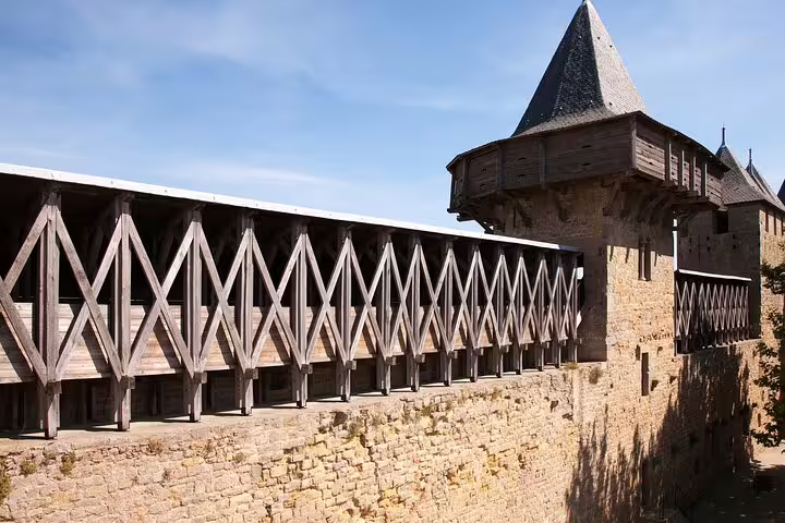 Fortified wooden walkway and tower on Carcassonne medieval walls, ideal for a self-guided scavenger hunt tour