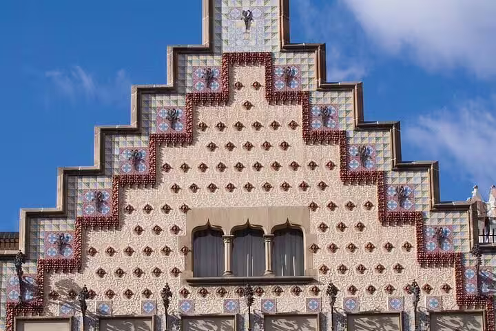 Beautiful tiled rooftop of Casa Batlló exemplifying Gaudi's innovative design in Barcelona's architectural landscape.