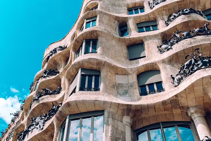 Explore Casa Milà's iconic undulating facade on the Best of Barcelona private tour including Sagrada Familia.