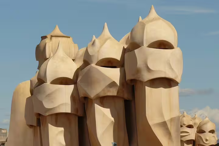 Unique chimneys of Casa Milà showcase Gaudí's architectural genius on the Private Barcelona Highlights tour.
