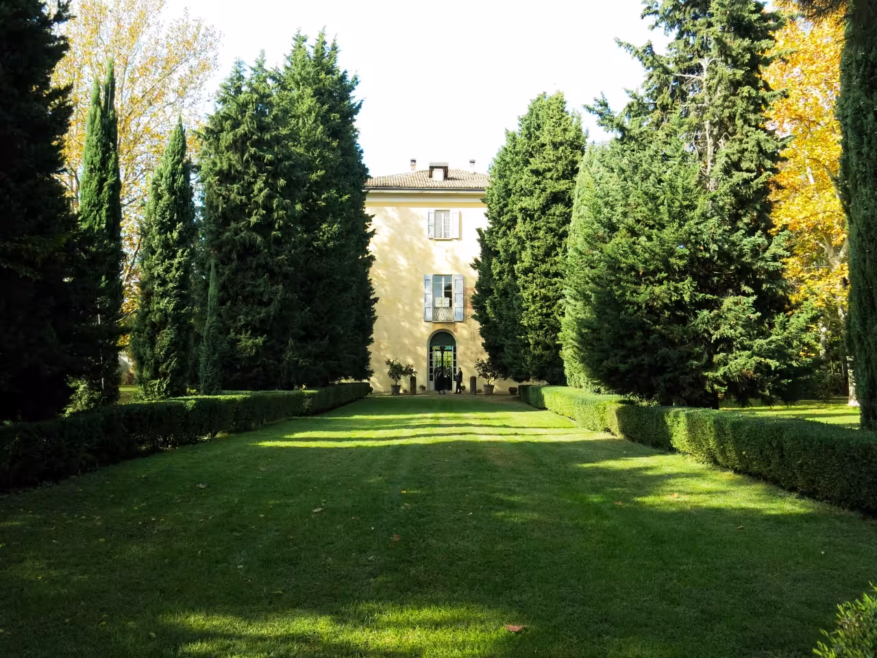 Tree-lined garden path leading to Casa Museo NENA near Bologna, part of the charming guided tour experience