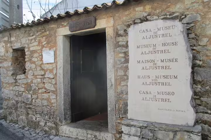 Historic stone facade of Casa-Museu de Aljustrel in Fatima, a key stop on a private full-day tour from Lisbon.