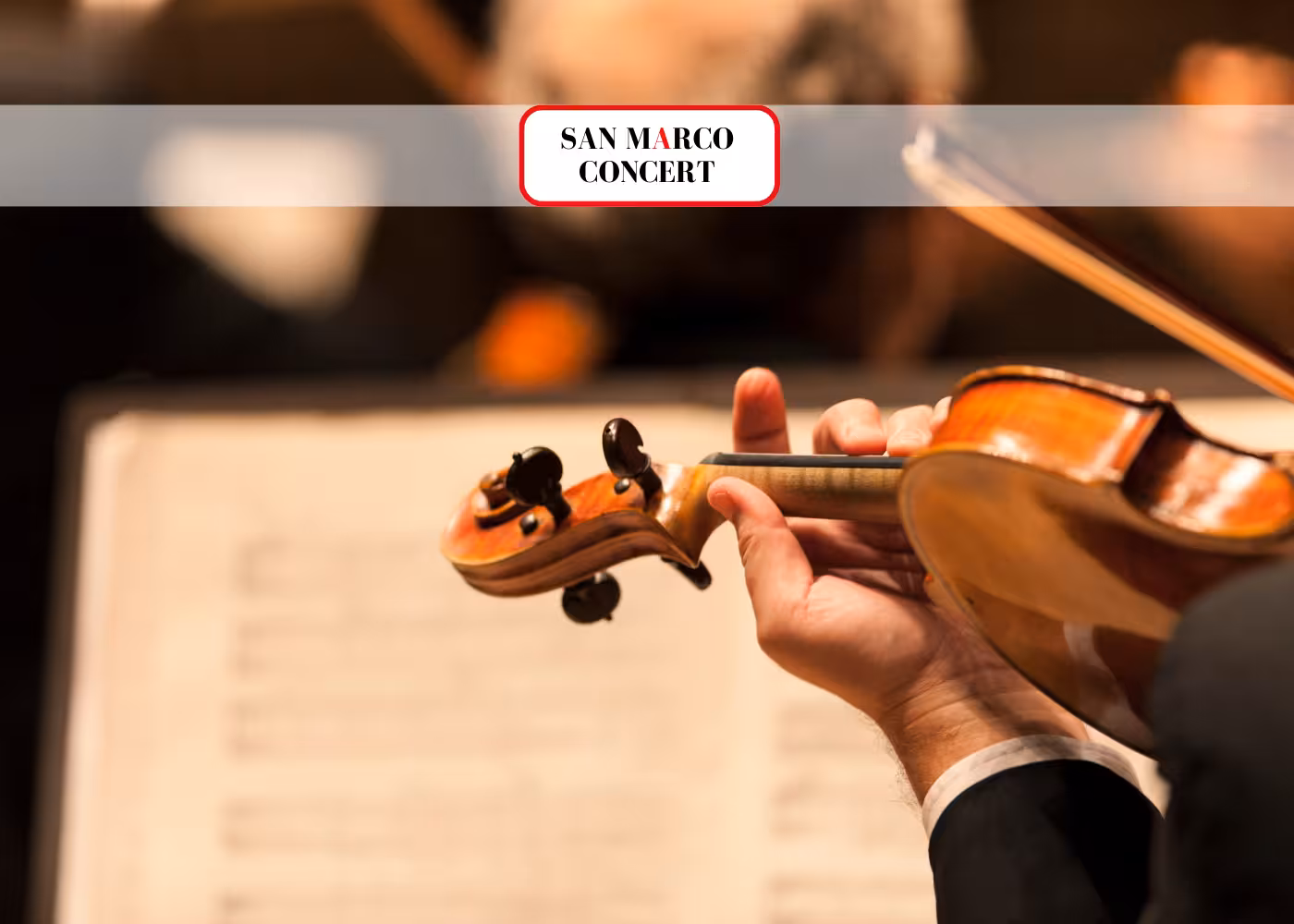 Close-up of violinist performing at San Marco Concert, highlighting the artistic ambiance and live music experience.