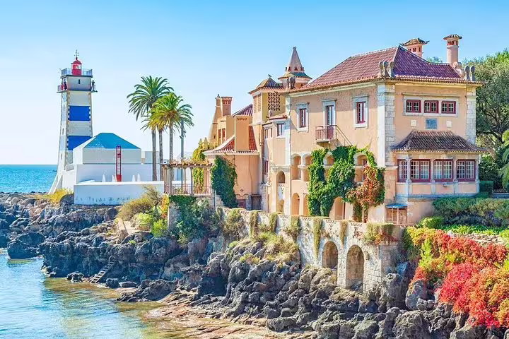 Picturesque Cascais coastline featuring vibrant historic buildings and a charming lighthouse.