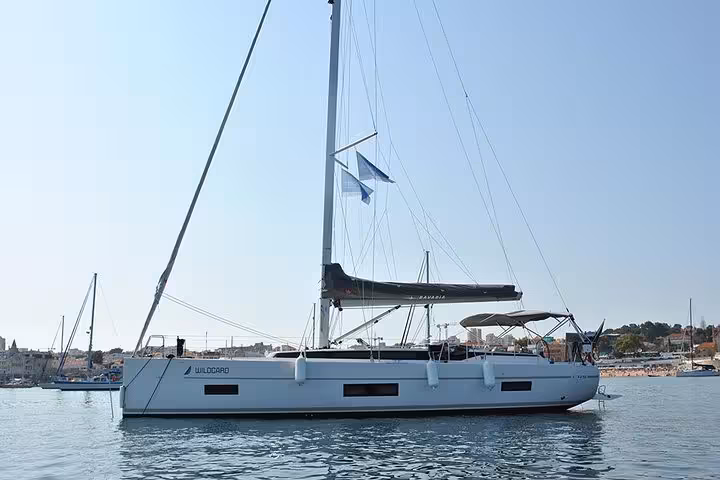 Modern sailboat on calm waters near Cascais, Portugal, ideal for a private half-day or full-day sailing cruise