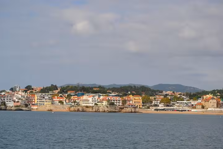 Cascais coastline and colorful seaside town viewed from a private sailing cruise on the Atlantic Ocean