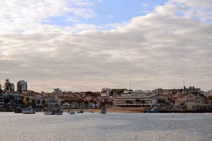 Cascais bay waterfront skyline from the water, scenic view on a private sailing cruise along the Portuguese coast