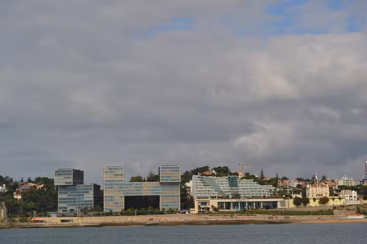Modern waterfront skyline near Cascais seen from a private sailing cruise, perfect half-day or full-day tour