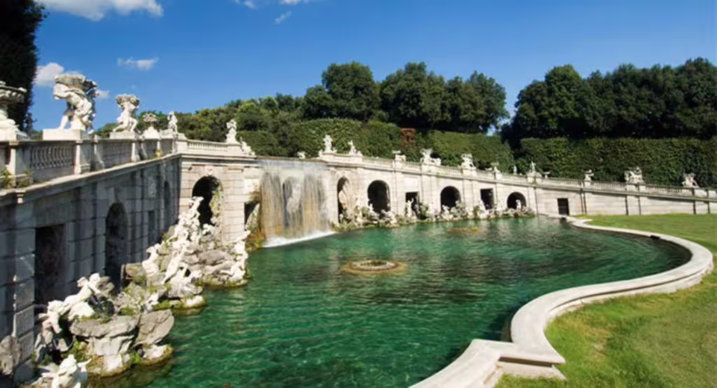 Baroque fountain complex and emerald pool in the royal gardens of Caserta Palace, seen on a private transfer day trip from Naples