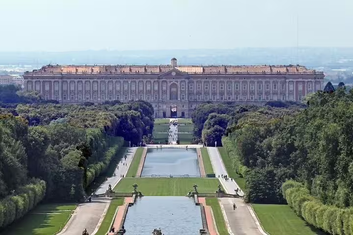 Panoramic view of Caserta Royal Palace and grand baroque gardens on a guided private tour from Naples or Rome in Italy