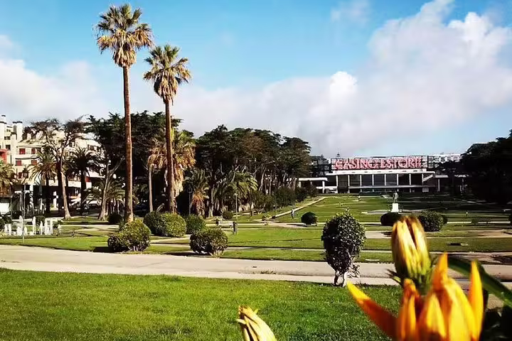 Lush gardens and palm trees surround the iconic Casino Estoril, a highlight on Sintra and Cascais customizable full day tours.