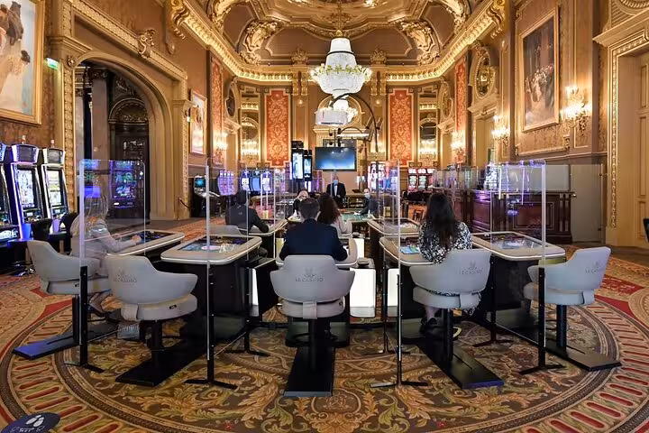 Luxurious gaming tables inside the opulent Casino de Monte-Carlo, perfect for a private Monaco tour experience.