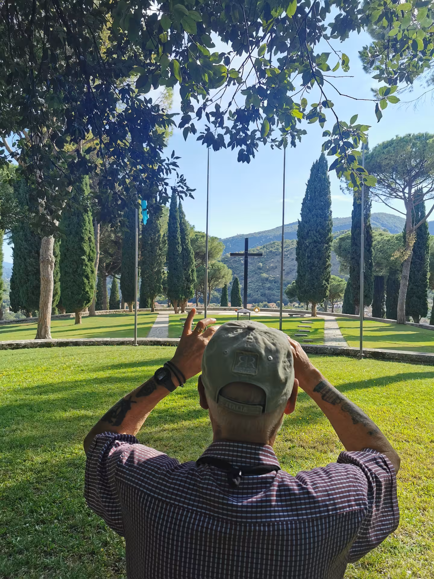Visitor captures serene Cassino cemetery view with distant mountains during the Red Poppy walking tour.