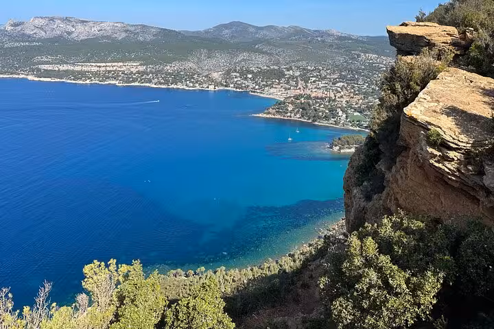 Panoramic cliff viewpoint over Cassis turquoise sea and Calanques coastline on a day trip from Marseille