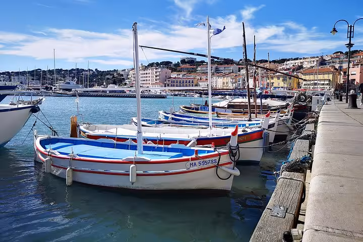 Colorful fishing boats moored in Cassis port on an Arles private tour to Aix-en-Provence and Cap Canaille