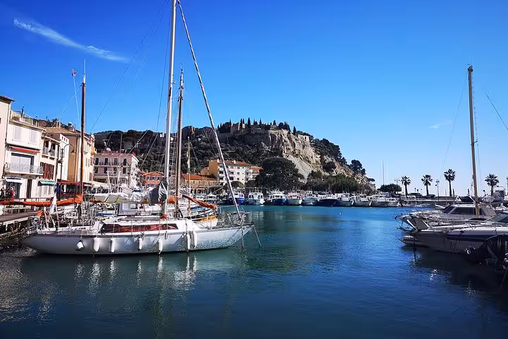 Cassis marina with sailboats and waterfront, a highlight of the Arles shore excursion to Cap Canaille and Cassis