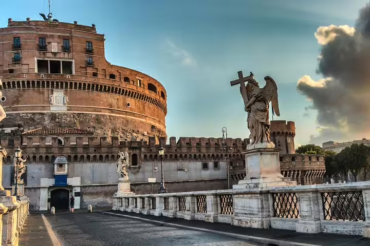 Castel Sant’Angelo and the angel statues on Ponte Sant’Angelo at sunrise, featured on a Rome in one day private tour