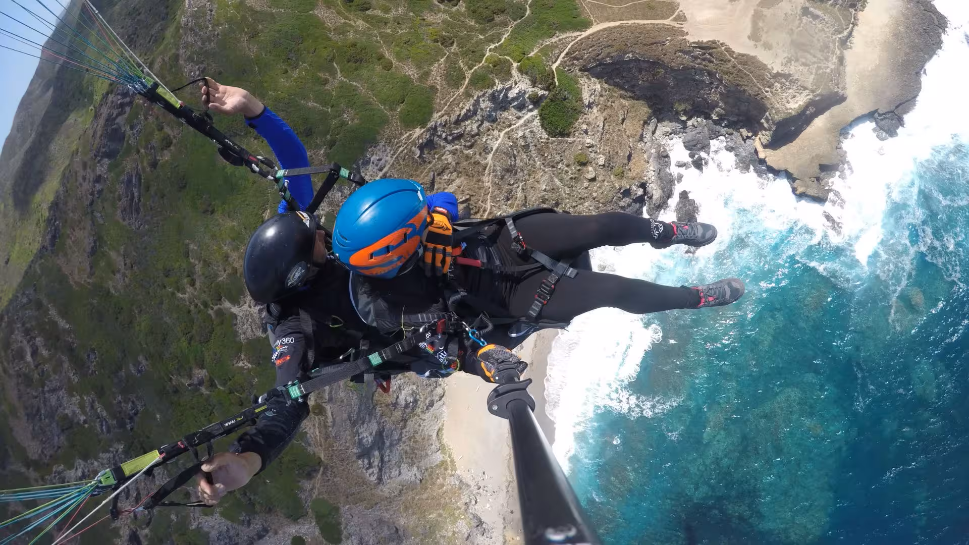 Soar high above the breathtaking cliffs and turquoise waters of Littigheddu during a tandem paragliding adventure.