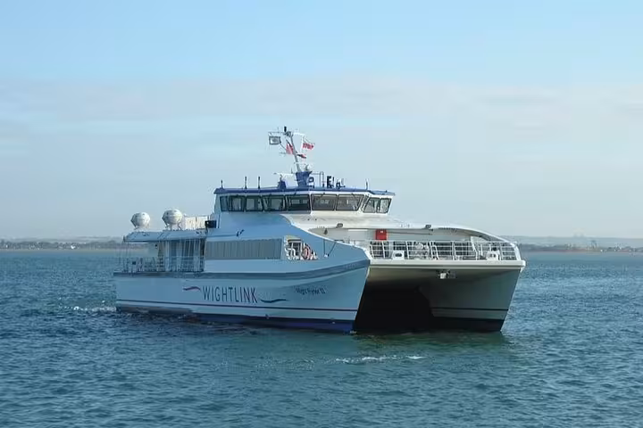 Modern catamaran ferry on a tranquil sea, highlighting the boat cruise element of the Finisterre and Cabo Vilan tour.