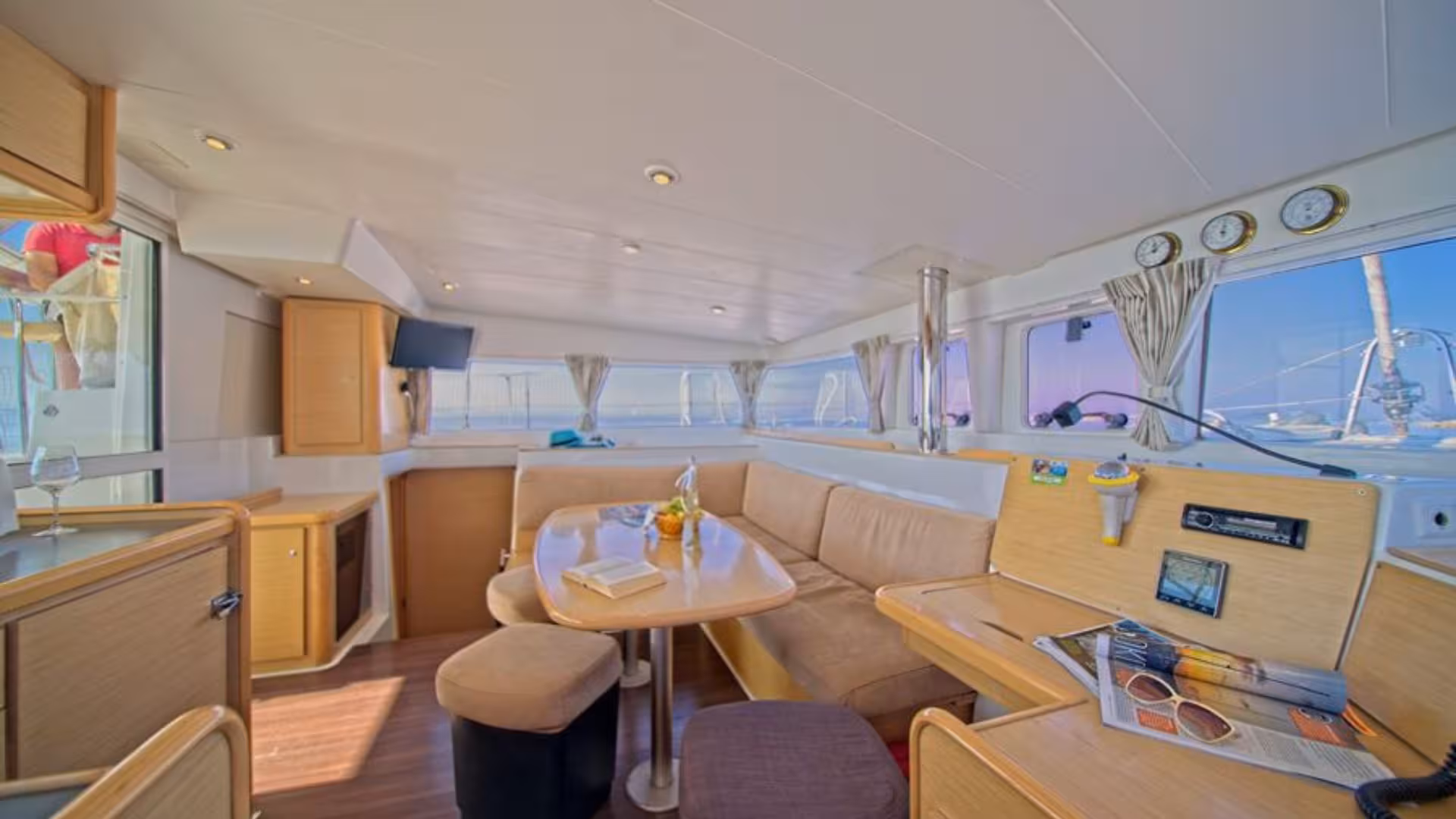 Comfortable interior of a catamaran in Tavolara Marine Protected Area, offering relaxation and modern amenities.