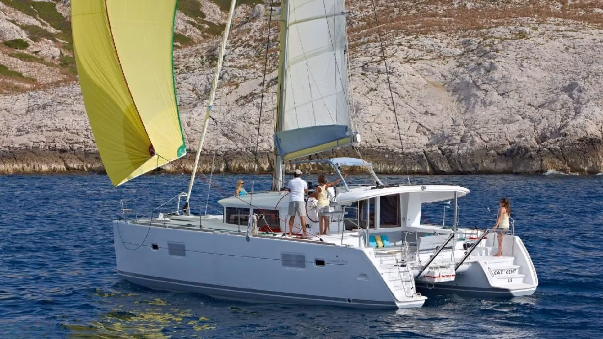 Luxurious catamaran sailing in the Tavolara Marine Protected Area near Olbia, perfect for an idyllic sea adventure.