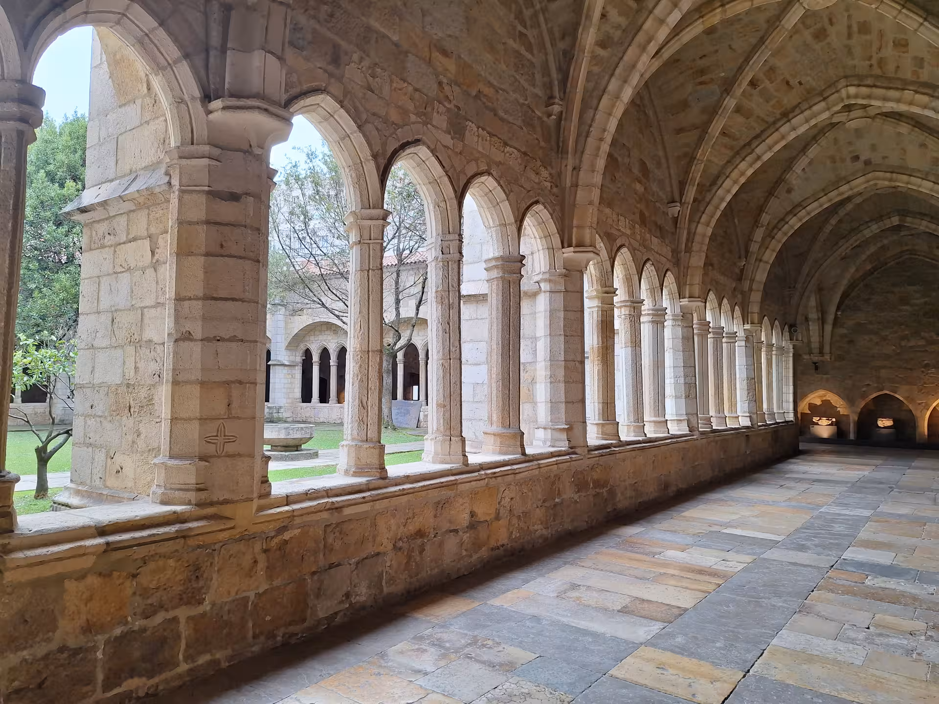 Stroll through the elegant cloisters of the Cathedral of Santander, highlighting its gothic arches and medieval architecture.