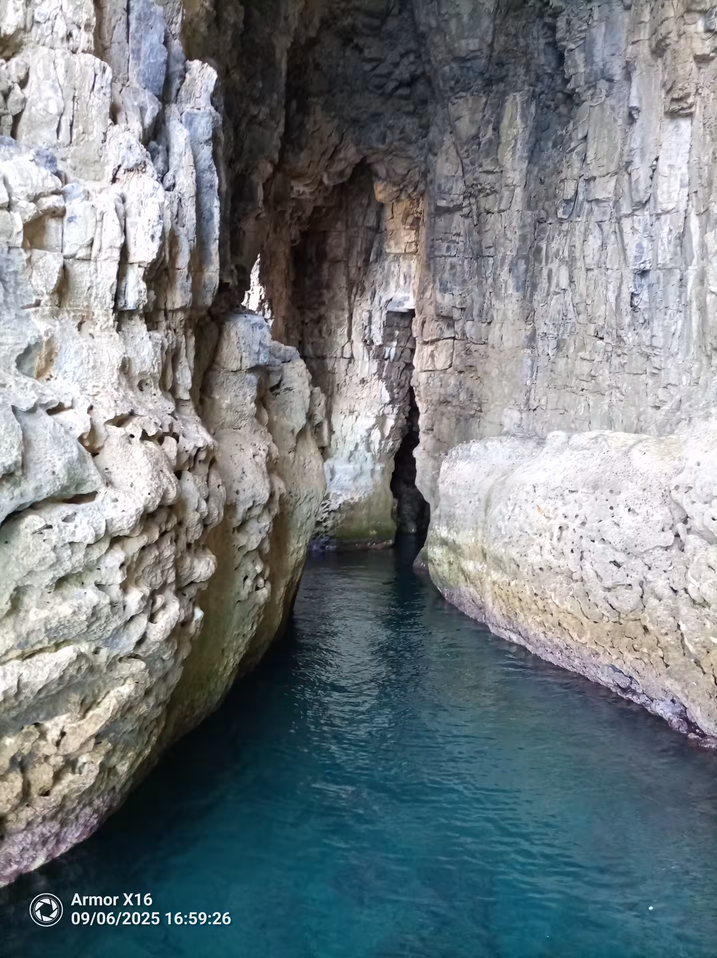 Hidden sea cave lagoon with turquoise water on the Cave & Snorkelling Experience by Bayliner M17, 3 hour tour