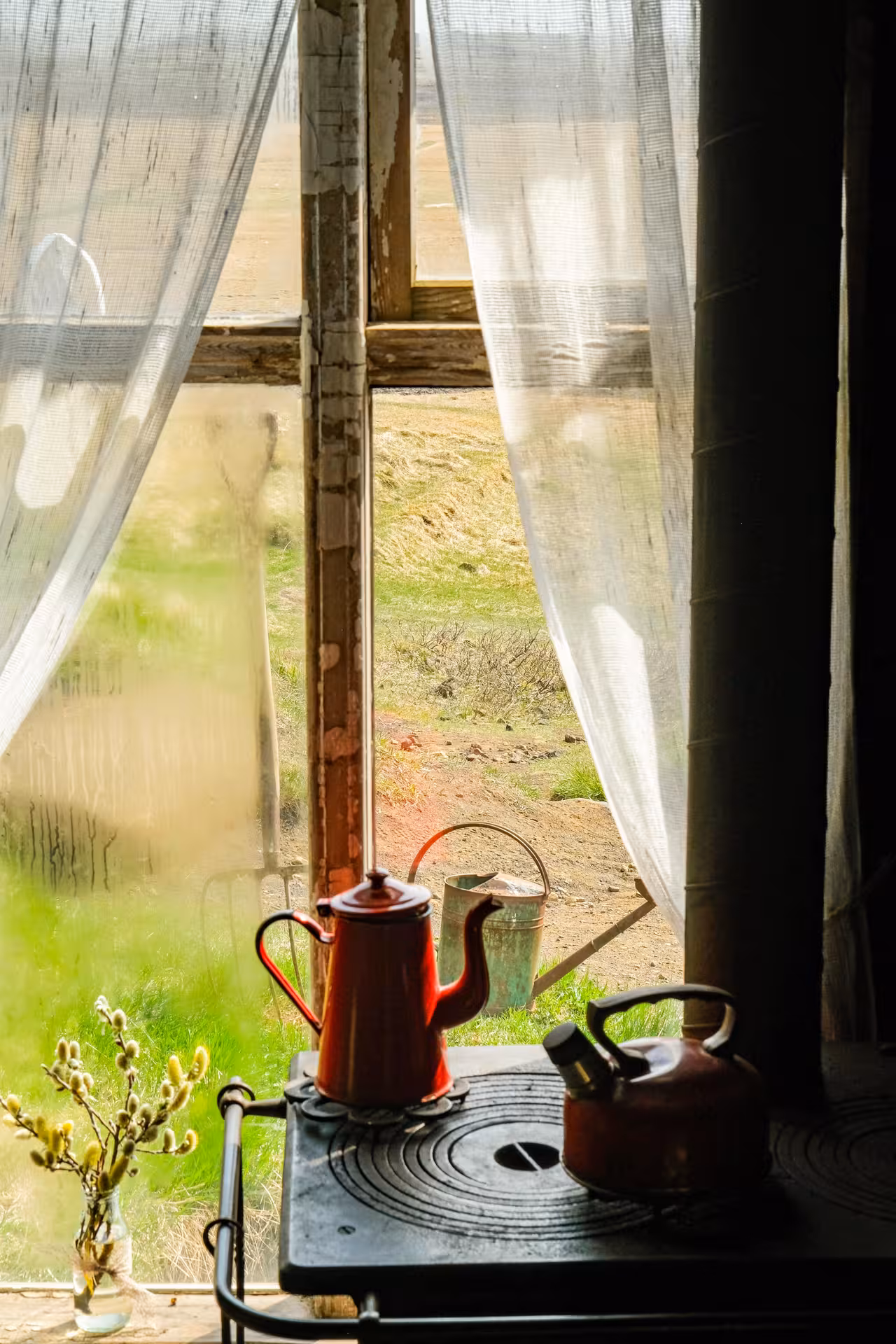 Cozy cave interior with rustic decor and red kettles, perfect for a unique standard cave tour experience.